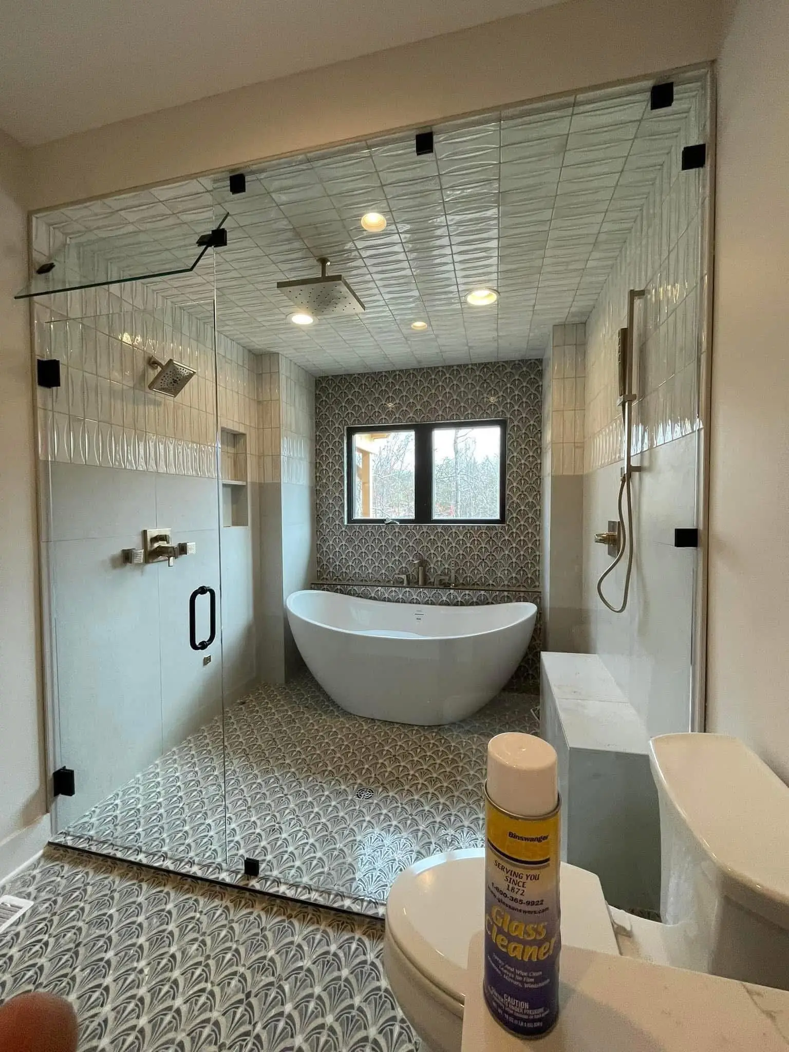 Custom glass shower door fitted in a bathroom
      alt=